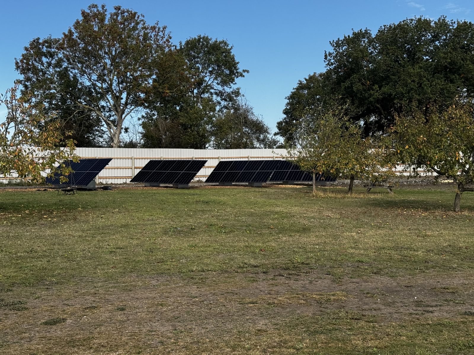 Completed ground-mount solar array on a rural commercial site