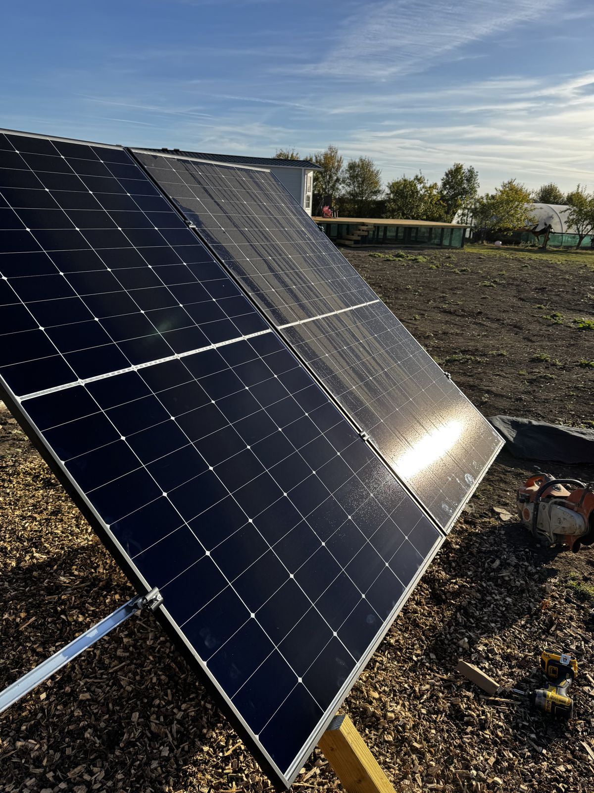 Sun flaring over a newly installed solar panel